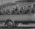 Group of men in open motor charabanc