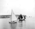 Fishing boat under sail and X-class dinghy